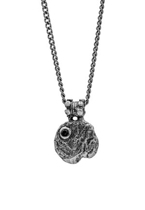 Silver-toned pendant on a linked chain, featuring a textured, abstract design with a central black gemstone and a small clamping detail.