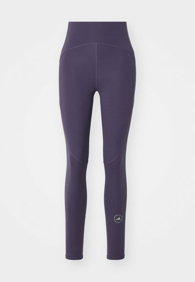 High-waisted lila leggings rugalmas anyagból, sima tapintással, varrás részletezéssel és egy kis logóval a lábszáron.