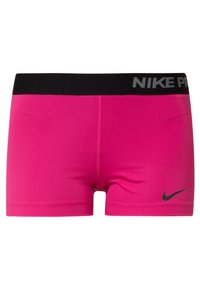 Shorts de compression Nike Pro, tissu rose vif, taille élastique noire avec le texte "NIKE PRO", et petit logo noir sur le côté gauche.