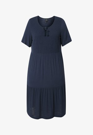 Laivansinis mekko, jossa on lyhyet hihat, röyhelöity yläosa, pyöreä pääntie, sidontatyyli ja kellotettu, kerroksittain leikattu hame. Pehmeä rakenne.