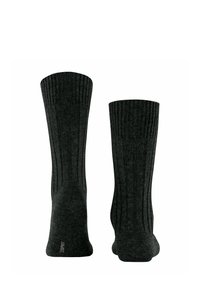 Dunkelgraue Socken mit vertikal geripptem Muster, in mittlerer Schafthöhe und aus weichem Material. Enthält ein dezentes Logo in der Nähe des Knöchels.