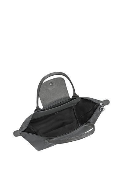 Gray handbag with open top zipper and flap revealing spacious black interior and two short handles.