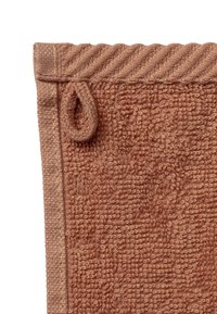 Brown textured towel with a loop for hanging. Features a contrasting woven edge at the top, with soft, plush fibers throughout.