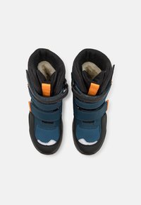 Children's winter boots with a dark blue and black color scheme, featuring orange accents, two adjustable straps, and a textured surface.