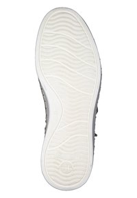 Podeszwa buta wykonana z białej gumy z teksturowanym falistym wzorem, z zaokrąglonym kształtem i widocznym logo z boku.