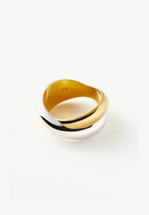 Gold and silver intertwined rounded ring with smooth, polished finish on a plain white background.