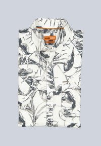White folded button-up shirt with black botanical print and "emilio adani" orange label inside the collar, regular fit.