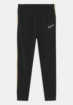 ACADEMY UNISEX - Tracksuit bottoms - black/saturn gold/white