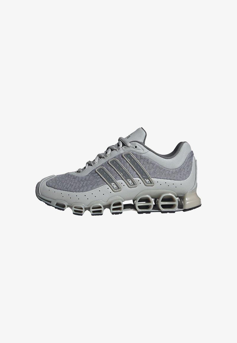 Light gray athletic shoe with mesh upper, decorative gray stripes, cushioned sole, and distinctive segmented outsole for cushioning.