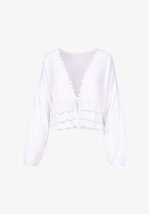 Weißes, kurzes Blusenshirt mit langen Ärmeln, V-Ausschnitt, Schleifenverschluss vorne, strukturiertem Stoff und Spitzenbesatz am Saum und Ausschnitt.