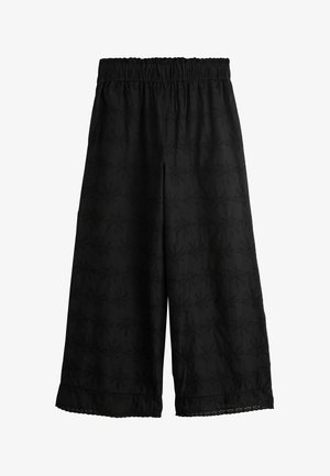 Sorte bukser med vide ben og elastisk talje, med et tekstureret mønster og blonder ved kanten. Letvægtsstof, afslappet design.