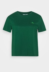 T-shirt vert à manches courtes en coton, avec un col rond et un petit logo vert brodé sur la poitrine.