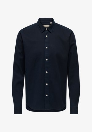 Navy blue button-up shirt with a spread collar, long sleeves, and white buttons; made of smooth fabric with a plain texture; curved hem.