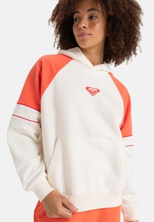 Hooded sweatshirt in cream and orange with a front pocket. Features raglan sleeves, red accent stripes, and a small logo on the chest.