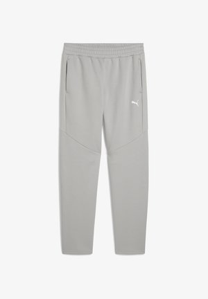 Pantaloni sportivi grigio chiaro con una cintura elastica, tasche laterali e un logo bianco sulla coscia sinistra. Tessuto liscio e design affusolato.