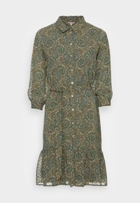 Vihreä kukkamekko, jossa on kevyt kangas, napitettava etuosa, kaulus ja röyhelöhäntä, sekä istuva vyötärö.