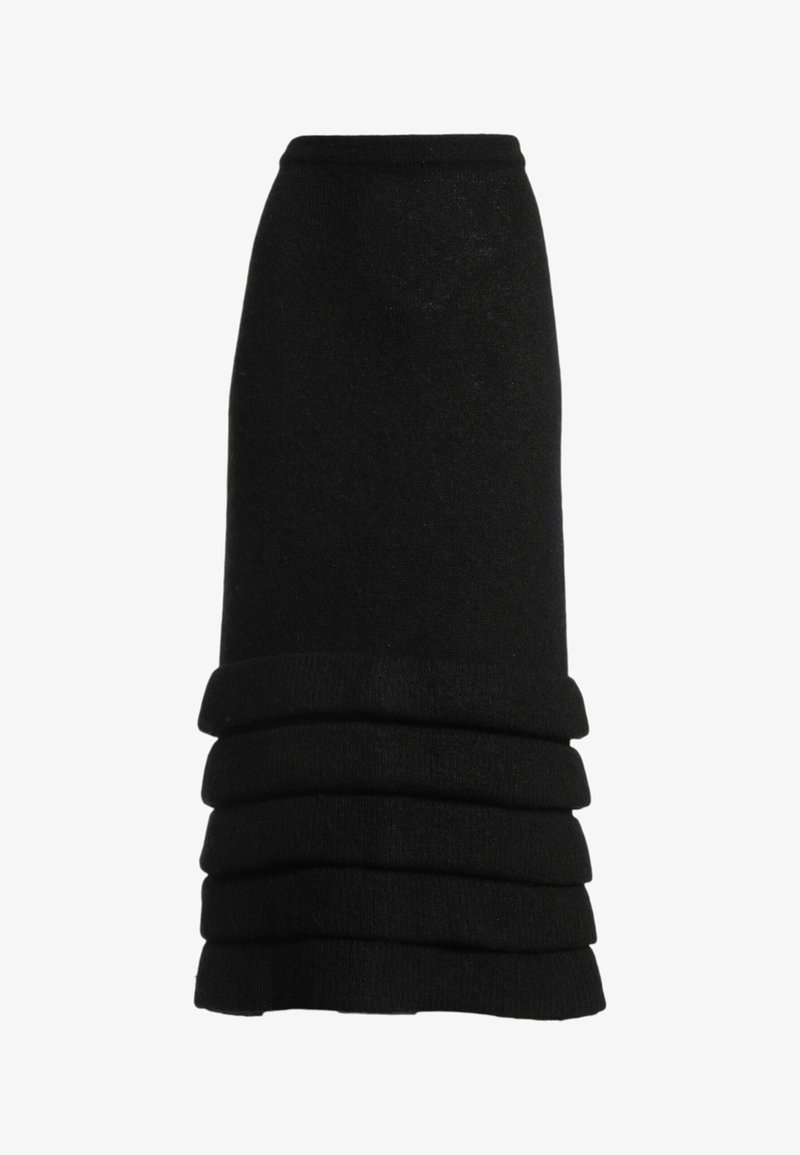 Jupe midi noire en tricot avec taille haute et volants horizontaux superposés près de l'ourlet.