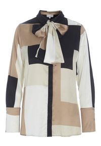 Blouse à manches longues en matière soyeuse avec un col noué. Les blocs de couleurs comprennent beige, blanc, noir et camel atténué. Design classique du col.