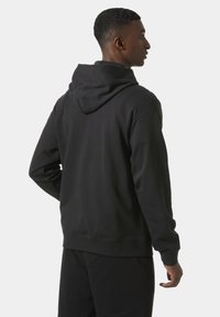 Black hooded sweatshirt with ribbed cuffs and hem, brushed interior, and a relaxed fit. Visible stitching and a centered back seam.