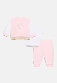 Ροζ φούτερ με λευκά μανίκια, τελείωμα με χρυσές λεπτομέρειες και γραφικό εκτύπωμα. Συνδυάζεται με λευκό T-shirt και ροζ παντελόνι. Υλικό βαμβάκι.