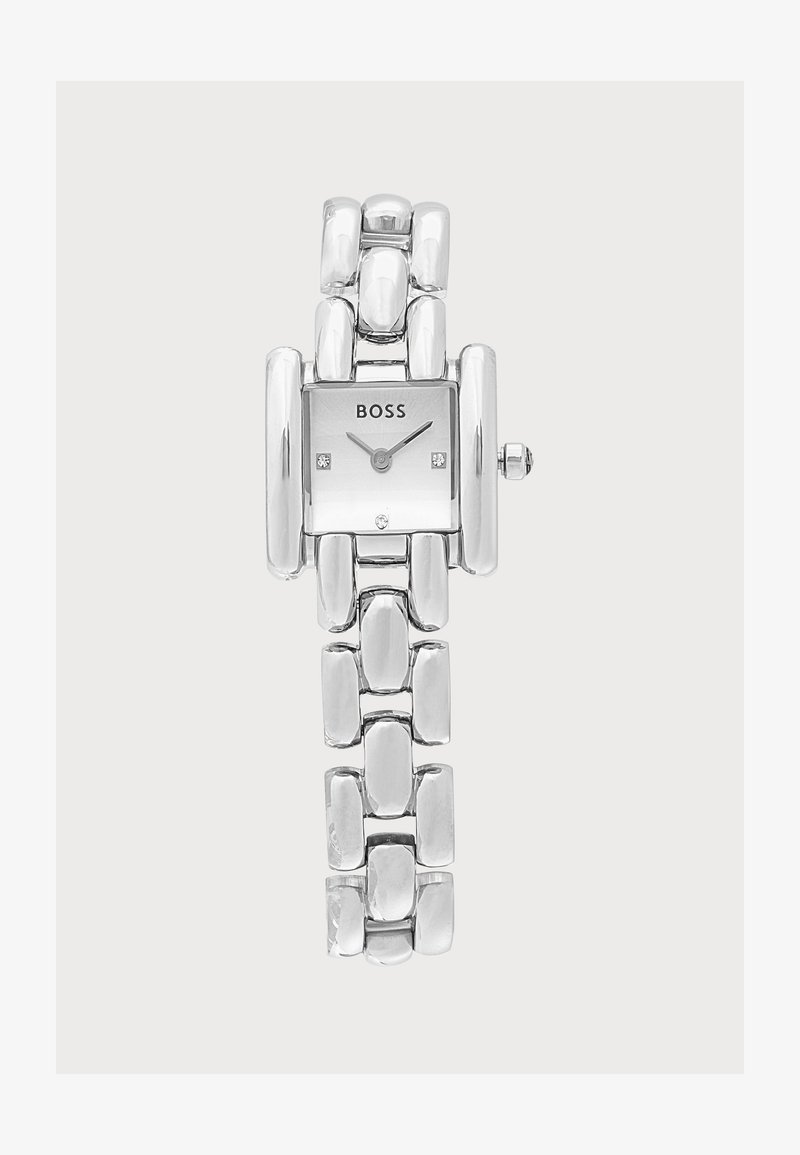 Montre-bracelet en métal argenté avec cadran rectangulaire, logo BOSS et marqueurs horaires minimalistes aux positions 3, 6 et 9 heures.