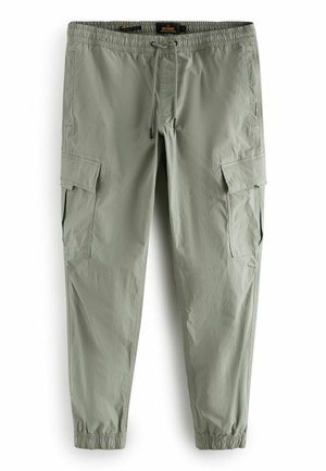Pantalon cargo vert clair avec taille élastique, cordon, poches latérales à rabat et poignets élastiques, présenté à plat sur fond blanc.