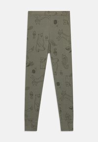 Green leggings featuring black drawings of animals and nature, including bears, foxes, and mushrooms, with a smooth, stretchy texture.