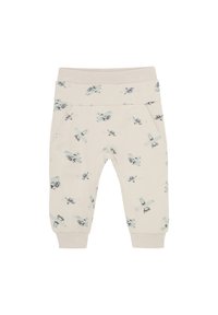 Krämfärgade byxor med elastisk midja och cuffs, försedd med ett mönster av ljusblå flygplan och helikoptrar. Två sidofickor ingår.