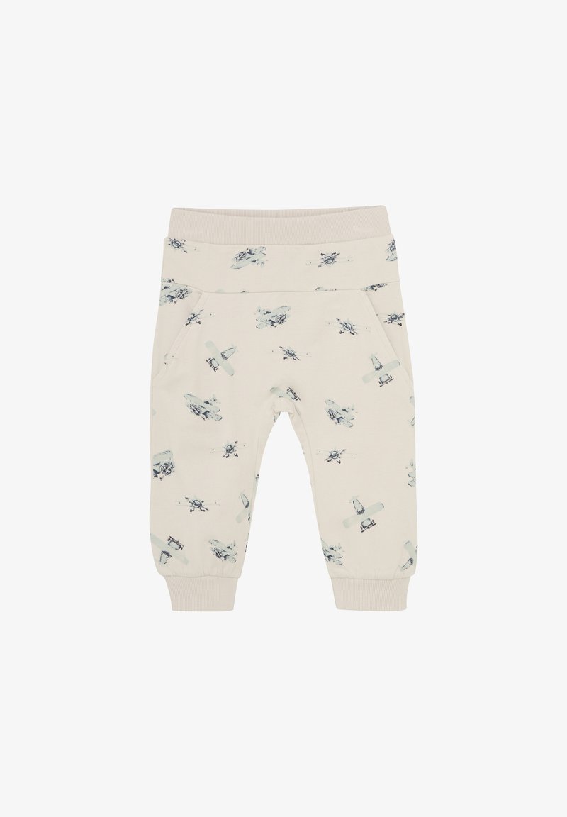Krämfärgade byxor med elastisk midja och cuffs, försedd med ett mönster av ljusblå flygplan och helikoptrar. Två sidofickor ingår.