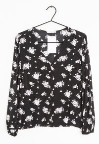 Schwarze Bluse mit langen Ärmeln und kleinem pinken Blumenmuster, Knopfverschluss vorne und V-Ausschnitt. Weicher Stoff mit gerafften Ärmeln und lockerer Passform.