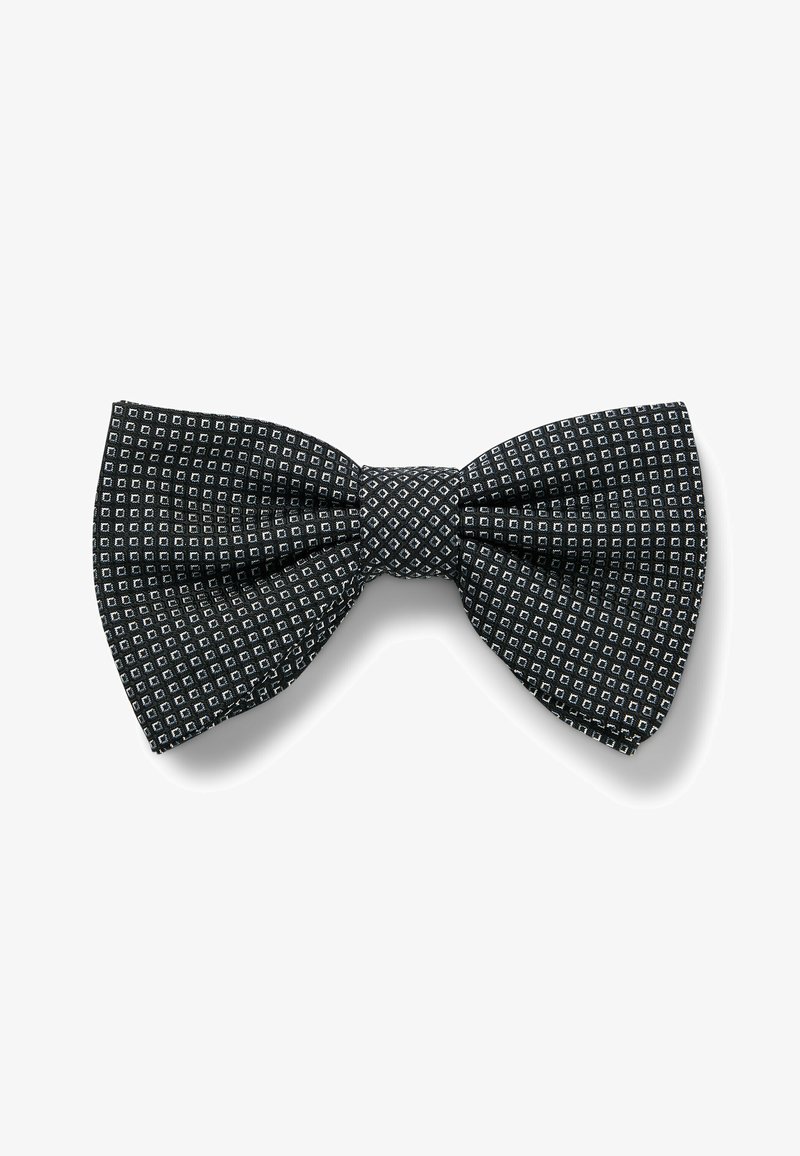 Black bow tie made of patterned fabric featuring small white squares. Textured finish, classic shape, with a central knot.