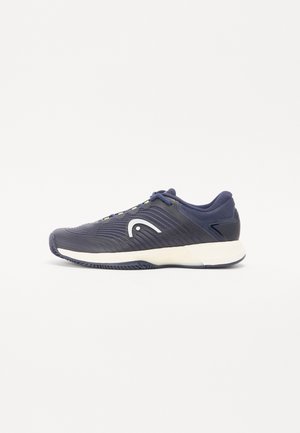 Navy athletic shoe with a textured design and white logo. Features a cushioned sole and dark blue accents on the upper and heel.