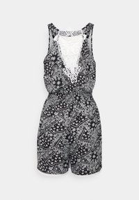 Svart jumpsuit med vitt paisleymönster, spetsdetalj på ryggen, utan ärmar, elastisk midja och scallopade kanter på korta ben.