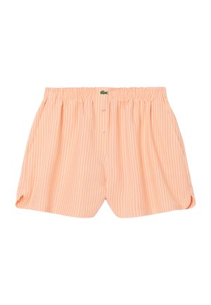 Pantalones cortos con cintura elástica de rayas verticales en blanco y durazno, con dos botones frontales y un pequeño logo de cocodrilo verde en la cintura.