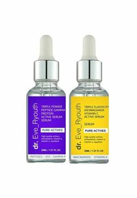 Dwa flakoniki serum w szklanych pojemnikach z zakraplaczami. Jeden ma fioletową etykietę, a drugi żółtą etykietę, obie oznaczone jako "Czyste Aktywne".