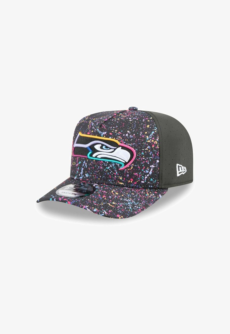 Black cap with splatter paint design in pink, blue, and yellow; features an embroidered Seahawks logo on the front and a flat brim.