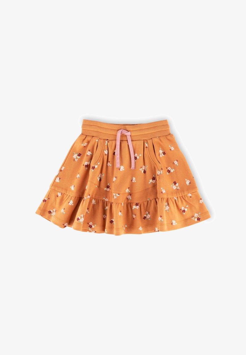 Orange tiered skirt made of soft cotton with a pink drawstring. It features a floral pattern with small flowers in various colors.