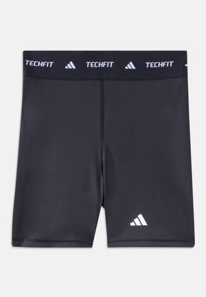 Svarte atletiske kompresjonsshorts med elastisk midjebånd merket "TECHFIT" og hvit Adidas-logo på venstre ben.