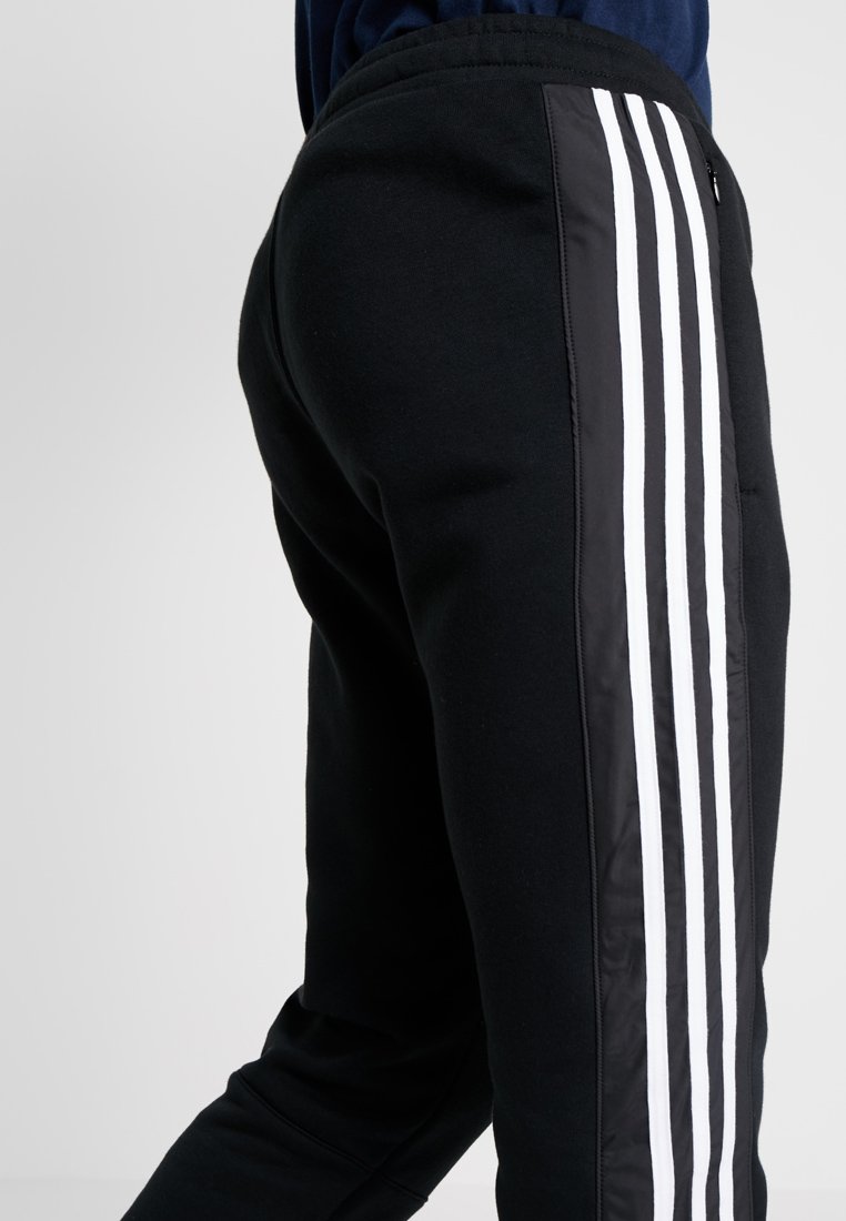 OUTLINE REGULAR TRACK PANTS Jogginghose black OUTLINE REGULAR TRACK PANTS Jogginghose black