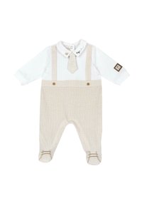 Bodysuit blanc à manches longues avec un col et des salopettes rayées beiges. Présente une petite cravate et un patch logo brodé sur le bras.