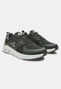 Black athletic shoes with a mesh upper, rubber sole, textured accents, and contrasting white midsole. Features padded collar and laces.