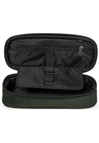 Custodia per tessuti di colore verde con zip nera, dotata di un interno nero e di una tasca removibile con strap elastiche per l'organizzazione.