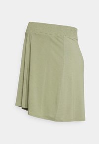 Saia verde-clara com um cós elástico, feita de um tecido suave; apresenta um design amplo e uma textura suave.