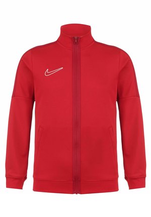 Veste à zip rouge en polyester. Présente un col montant, des poches latérales et un logo Nike blanc sur le haut à gauche de la poitrine.