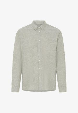 Jasnoszara koszula na długi rękaw zapinana na guziki, z ostrym kołnierzykiem i guzikami na mankietach rękawów.