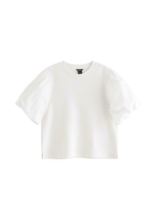 Hvid kortærmet cropped T-shirt med puffede ærmer og rund halsudskæring, vist på hvid ensartet baggrund.