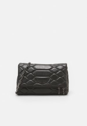 Black quilted handbag with a rectangular shape, featuring a chain strap, embossed logo, and zippered pocket on the front.