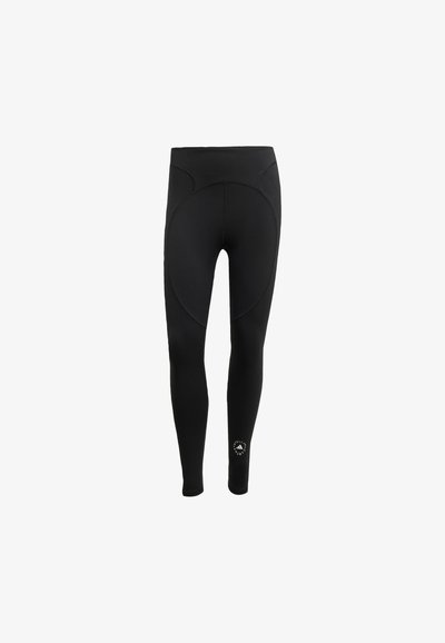 Leggings pretas femininas feitas de tecido elástico, com uma cintura alta e design sem costuras, apresentando um painel traseiro Circular e detalhe do logótipos.