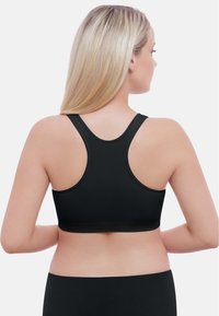 Schwarzer Sport-BH mit Racerback-Design, nahtloser Textur und breitem Band für Unterstützung. Mit einer glatten Oberfläche gestaltet, geeignet für Sportbekleidung.
