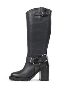 Black leather knee-high boot with a chunky heel, textured surface, and a decorative strap featuring a metal ring and buckle detail.